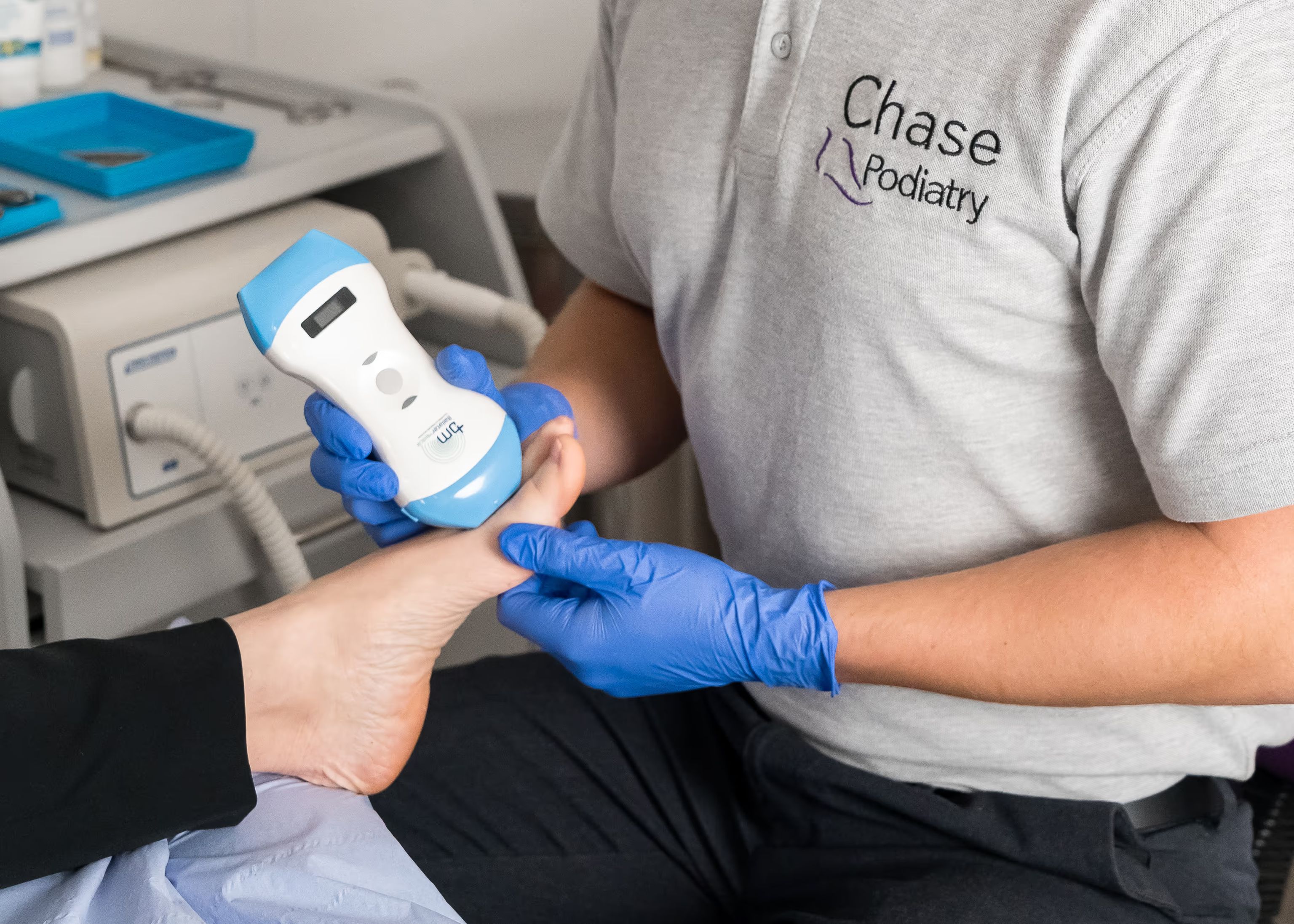 A Chase Podiatry podiatrist performing an ultrasound of a patients first toe